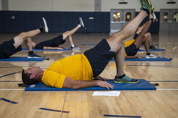 Sailors warm up for new physical readiness test events.