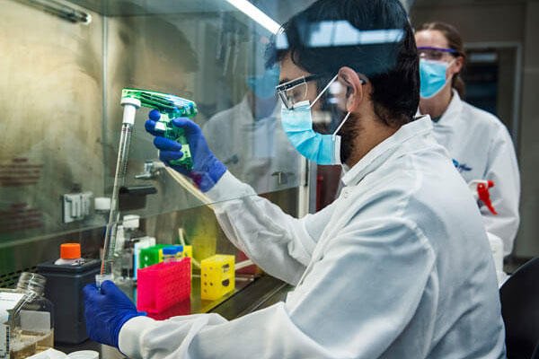 Male scientist in a Pfizer lab