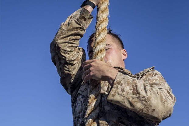 A U.S. Marine climbs down a rope during the 12th annual Recon Challenge at Marine Corps Base Camp Pendleton, California, April 30, 2021. (Lance Cpl. Alison Dostie/U.S. Marine Corps photo) A Marine climbs down a rope during the 12th annual Recon Challenge.